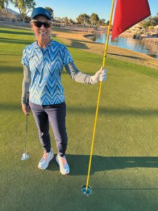 Tina Fisher strikes a hole in one